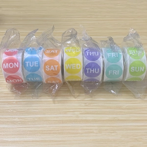 Set of 7 colorful rolls of weekday planner stickers showing Monday to Sunday labels