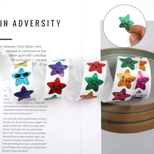 Roll of 500 holographic glitter star stickers with funny facial expressions for rewards