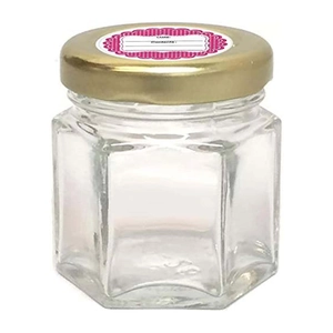 Hexagon glass storage jar with metal lid and adhesive food labeling date sticker