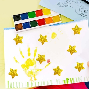 Roll of 500 gold glitter star reward stickers for kids crafts and school charts