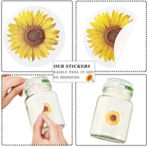 500pcs roll of sunflower thank you stickers showing easy peel off and application on jars
