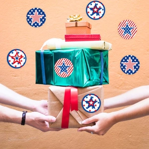 Close-up of USA flag star stickers on gift boxes with red, white and blue patterns