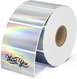 Detailed macro view of holographic thermal labels on a roll with rainbow metallic finish