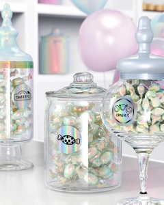 Detail of holographic thermal labels on glass candy jars with iridescent shine