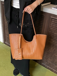 Vintage brown woven large tote bag with shoulder straps and matching mini pouch