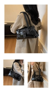 Detailed close-up of a black Y2K punk shoulder bag with silver rivets and buckles