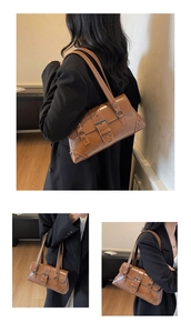 Detailed views of caramel brown shoulder bag with metallic buckle and rivet accents