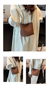 Three-way view of a dark brown frosted suede bucket bag with leather shoulder strap