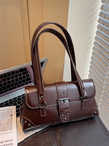 Vintage dark brown faux leather underarm bag with belt buckle and silver rivets