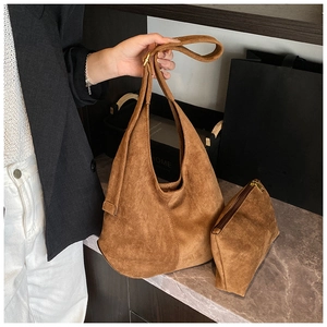 Detail view of the brown frosted canvas hobo bag set with metal buckle and inner pouch
