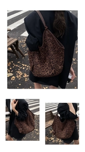 Street style view showing the large leopard print tote bag with brown leather straps