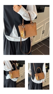 Brown frosted leopard style bucket bag shown in hand and crossbody wearing modes