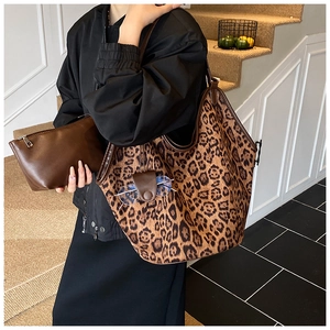 Detailed leopard print tote bag with brown pouch and functional glasses holder strap