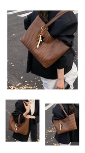 Detail of vintage woven tote bag with ethnic bead tassel and spacious leather texture