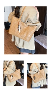 Detail of brown woven tote bag with checkered texture and colorful beaded tassel charm