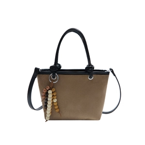 Brown frosted leopard print bucket bag with wooden bead charm and black leather handle