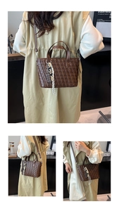 Detailed view of dark brown woven leather bucket bag with decorative cord and chocolate charm