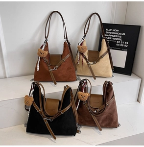 Four retro suede tote bags in contrast colors with leather trim and bear charms