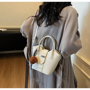 White lychee pattern bucket bag with metal lock and cute bear plush charm detail