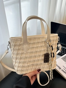 Retro cream woven tote bag with chocolate charm and adjustable shoulder strap