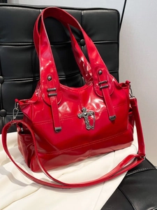 Vintage red glossy patent leather tote bag with punk cross pendant on black leather