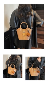 Detailed views of brown leather bucket bag with plush bear charm and plaid scarf