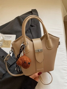 Fashion khaki bucket bag with litchi pattern, metal buckle, and cute teddy charm