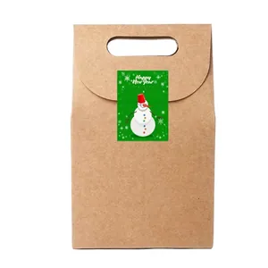 Brown kraft gift bag with snowman sticker and Happy New Year message for holiday decor