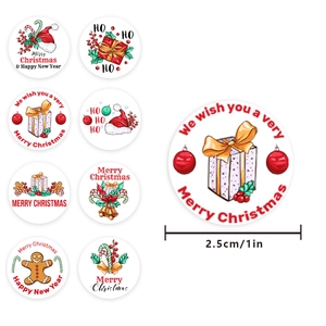 Roll of 1-inch Merry Christmas stickers featuring assorted festive holiday designs