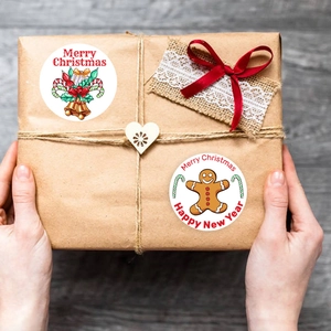 Christmas kraft paper gift box decorated with festive Merry Christmas round stickers