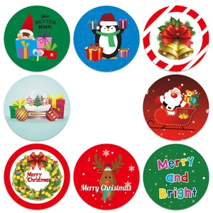Roll of 8 assorted Christmas stickers featuring Santa, reindeer and festive greetings