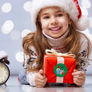 Christmas gift stickers featuring festive elf graphics and decorative festive typography