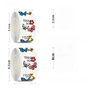 Detail view of 500 butterfly thank you stickers showing roll dimensions and patterns