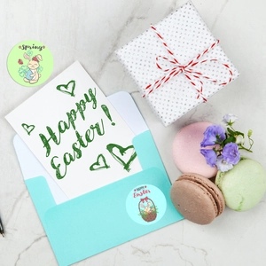 Detailed view of round Easter rabbit stickers used on gift envelopes and greeting cards