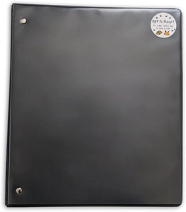 Detail of a black leatherette folder featuring a circular Opt To Adopt animal rescue sticker