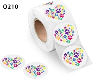 Detail view of colorful paw print heart stickers on a roll for pet gifts and toys