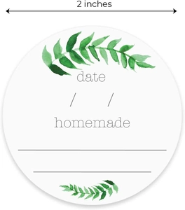 Detail of 2-inch round white homemade labels with green leaves and date writing space