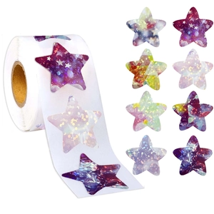 Detail view of holographic star stickers featuring laser galaxy and aurora patterns on a roll