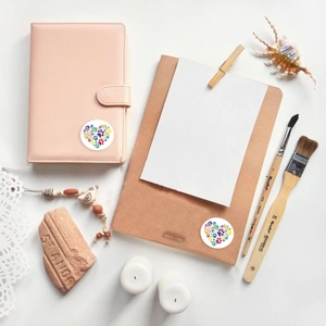 Self-adhesive colorful heart paw print stickers on a notebook and clipboard