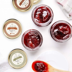 Detail of round kraft labels for canning jars with date and content writing space