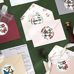 Roll of 500 butterfly floral thank you stickers on colorful envelopes for gift packing