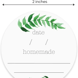 2-inch round homemade labels with green leaf design and date lines for jars