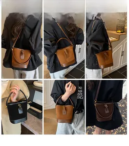 Detail view of vintage leather bucket bag in multiple colors with metal buckle closure