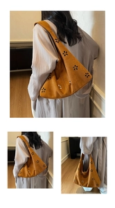 Vue détaillée du sac hobo marron avec motifs floraux découpés au laser et texture en daim