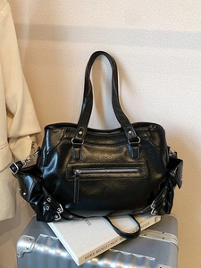 Large black punk style faux leather tote bag with metallic zippers and stud details