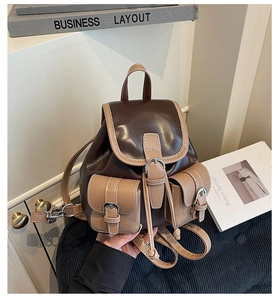Detailed view of the vintage contrast-color mini backpack with premium metal buckle and stitching