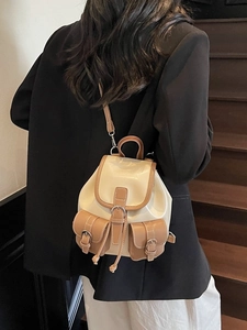 Vintage cream and brown PU leather mini backpack shown on model for daily commute style