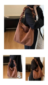 Detail of warm brown suede tote bag featuring wide ruched cloud shoulder straps