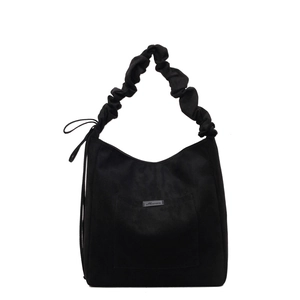 Black matte tote bag with ruched handle and side drawstring details in urban style