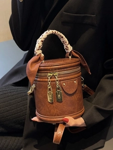 Retro brown cylinder bucket bag with leopard print scarf handle and gold zippers